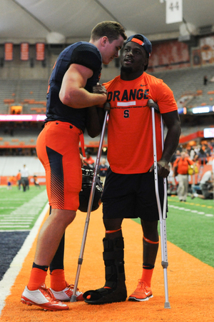 Antwan Cordy, right, used crutches on Sept. 1 against CCSU when he returned to the field after exiting in the first quarter with an injury to his right leg.