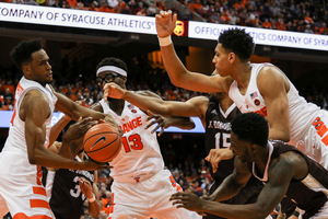 Syracuse players scramble for the ball against St. Bonaventure. The Orange are coming off of a 60-57 overtime loss to the Bonnies, just their second of the season.