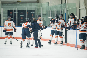 Syracuse, pictured during an early-season loss to Wisconsin, attempted only four shots less than Cornell but gave up three more goals.