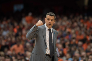 Tony Bennett, pictured against Syracuse last season, has built a winning culture at Virginia behind his five pillars and packline defense.