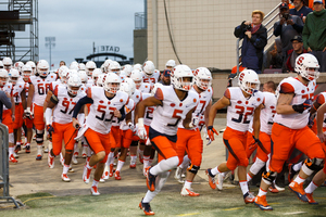 Syracuse runs out of the tunnel before dropping its last road game of the 2017 season. In its first of the 2018 season, it took down Western Michigan, 55-42.