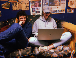 Sam Ogozalek, The Daily Orange’s 2018-19 editor-in-chief, left, talks with Ali Harford, right, the fall 2018 managing editor, during a production night in spring 2018. 
