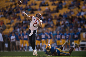 Eric Dungey attempts a long pass.