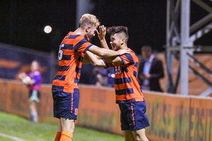 Ryan Raposo (right) assisted on Syracuse's first goal and scored the second in the Orange's three-goal win Monday.