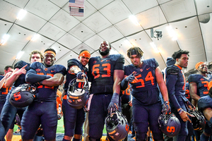 Syracuse players posing after their sixth victory of the season over North Carolina State.