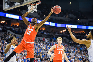 Paschal Chukwu blocks a shot in SU's Sweet 16 matchup with Duke last season.