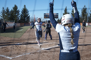 Syracuse celebrates as a runner crosses the plate.