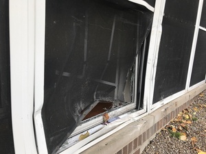 The car crashed into a window on the first floor of Walnut Hall. 