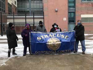 Board members of the local NAACP branch speak in front of the Onondaga County Justice Center at the Saturday press conference.
