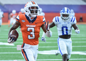 Taj Harris running to the end zone after a catch versus Duke.