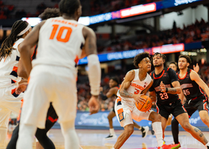 Judah Mintz (pictured No. 3) led the Orange in assists and was third in scoring against the Huskies.