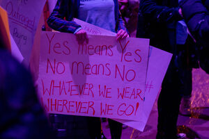 Attendees of the march protested with signs outside of Hendricks Chapel after hearing remarks from speakers. This year's slogan for the rally, 