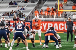 Syracuse quarterback Kyle McCord (orange jersey) showcased poise in the pocket during Syracuse's 2024 Spring Game. 