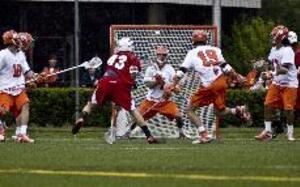 Al Cavalieri attempts to save a shot by Maryland's Jake Bernhardt during the Orange's 11-6 victory in the NCAA quarterfinals