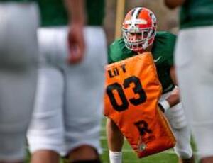 Cody Catalina performs a blocking drill during spring football practice. Catalina is one of three tight ends, including Nick Provo and Mike Owen, used in Rob Spence's new offense for the 2009 season.