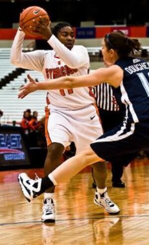 Tasha Harris looks to pass the ball over Villanova defender Kyle Dougherty. Harris averages 3.4 points and 4.6 assists per game for the Syracuse women's basketball team. 