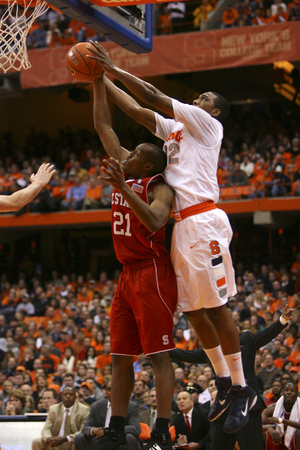 Kris Joseph blocks a shot during SU's 65-69 win over North Carolina State on Saturday.