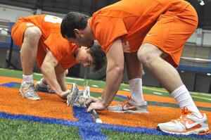 (From left) Ricky Buhr and Chris Daddio will split time taking faceoffs this year.