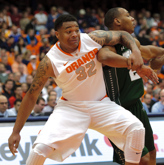 Syracuse forward DaJuan Coleman jockeys for position during a free throw.