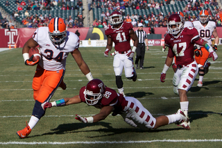 Adonis Ameen-Moore steps away from a would-be tackler on the way to the end zone.