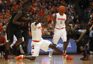 Syracuse center Baye Moussa Keita looks to pass up the court.