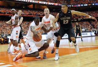 Baye Moussa Keita scrambles for the balll. Keita played just 12 minutes and snagged three rebounds.