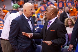 David B. Falk and atheletic director Daryl Gross share words near the end of the Orange's victory Wednesday night.