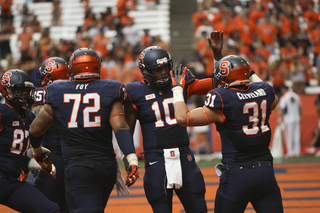 Syracuse quarterback Terrel Hunt celebrates with fullback Clay Cleveland.