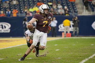 Robert Welsh closes in on Mitch Leidner in the backfield. 