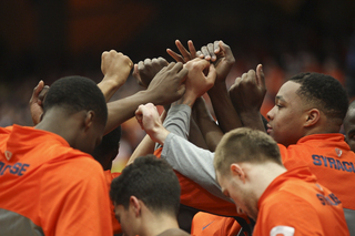 The Orange break their huddle before the game. 