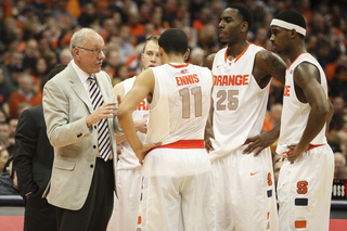 Coach Boeheim discusses a play with his starters. 