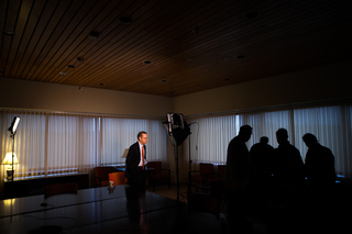 Syverud waits while reporters, photographers and camera crew prepare for his next interview. 