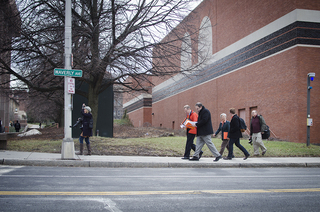 Syverud, Kevin Quinn, and others walk from Schine to Slutzker Center for International Students.