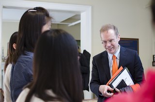 Syverud interacts with students during his visit to the Slutzker Center.