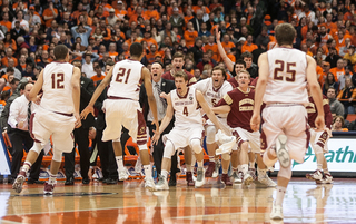 The Eagles celebrate as time expires and Syracuse's perfect season is ended. 