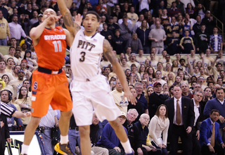 Wright looks on as Ennis releases a shot that gave Syracuse the 58-56 win. 