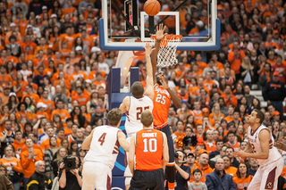 Boston College's Joe Rahon tries a floater over Syracuse center Rakeem Christmas. 