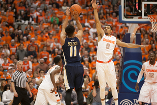 Michael Gbinije closes out on Georgia Tech's Chris Bolden, who finished with five points and four rebounds. 