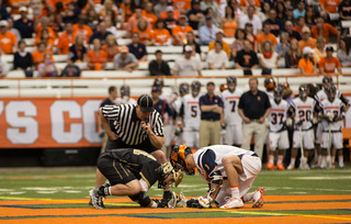 Chris Daddio squares up against Bryant's Kevin Massa. Daddio managed nine faceoff wins against the nation's leading X specialist.