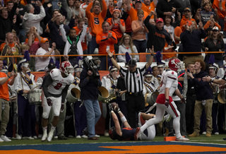 Syracuse wide receiver Ben Lewis raises the ball after holding onto a touchdown pass from Long. The score, confirmed by the officials after a review, was the Orange's first passing touchdown in three weeks.