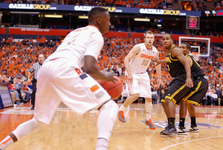 Joseph handles the ball near the sideline as Cooney looks on.