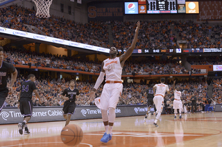 Christmas raises his left hand in celebration after his dunk put SU up by 17 in the second half.