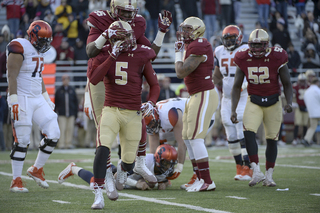 BC defensive back Ty-Meer Brown (5) and defensive end Seyi Adebayo celebrate a sack of SU quarterback AJ Long.