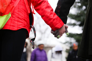 Rally-goers hold hands in four minutes of silence in honor of Michael Brown, an 18-year-old who was shot by a police officer in Ferguson, Missouri in August, and others who have been affected by police brutality.