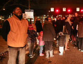 Protesters react to the growing group of cars following them near the Syracuse University campus. 