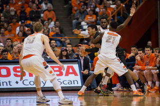 Tyler Roberson and Rakeem Christmas trap Wake Forest forward Devin Thomas. The WFU star big man was ineffective in the first half.