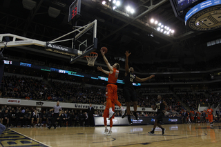 SU guard Trevor Cooney rises for a layup. He finished with 12 points but was hindered by four personal fouls.