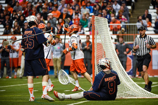 UVA goalkeeper Matt Barrett and defender Scott Hooper look on after a Syracuse goal. 