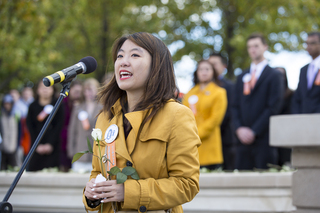 Leah Garlock, a Remembrance Scholar, speaks during the Rose Laying Ceremony at the Remembrance Wall.