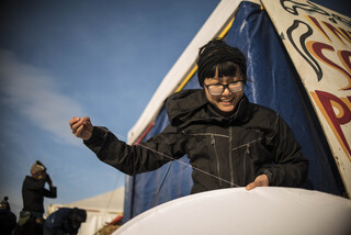 Yi-yi from the Bay Area in California is a social rights activist and technician that came to Standing Rock to offer help and volunteer. Spending most of her time at the art tent, she's seen here sewing a medicine wheel that will be used as a sign of peace and non-violence during direct actions.